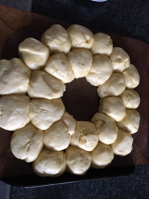 brioche buns tear and share buns after final prove on a baking tray