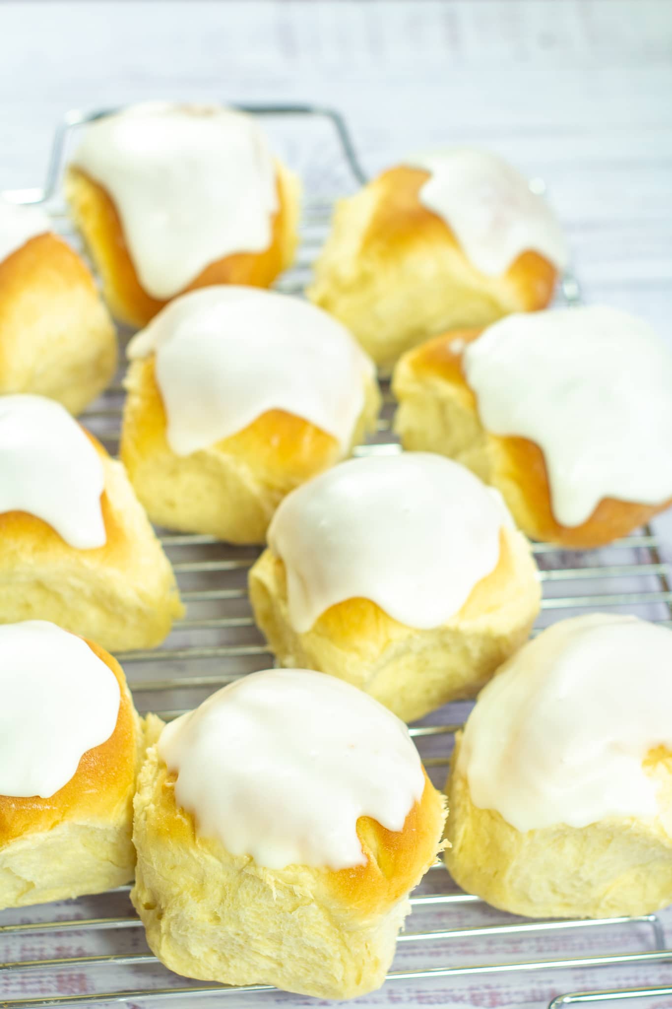 iced buns on a wire rack