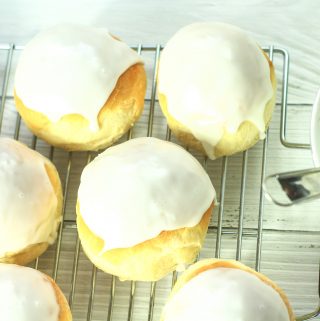 iced buns on a wire rack