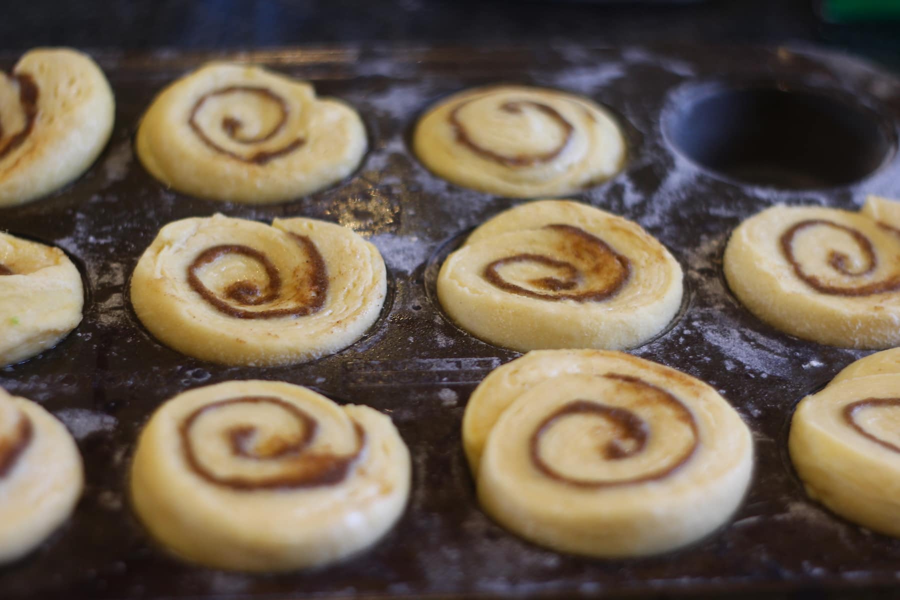 danish pastry cinnamon rolls Danish Pastry Cinnamon Rolls after the final prove in a muffin tray