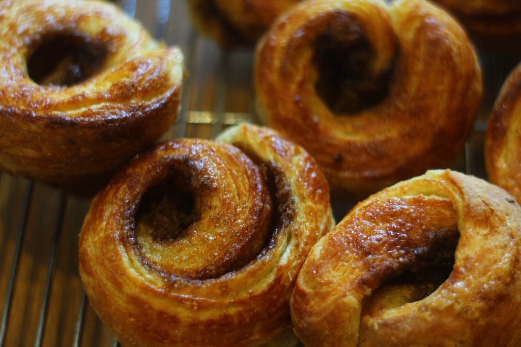 Danish Pastry Cinnamon Rolls Danish Pastry Cinnamon Rolls out of the oven and on a wire rack