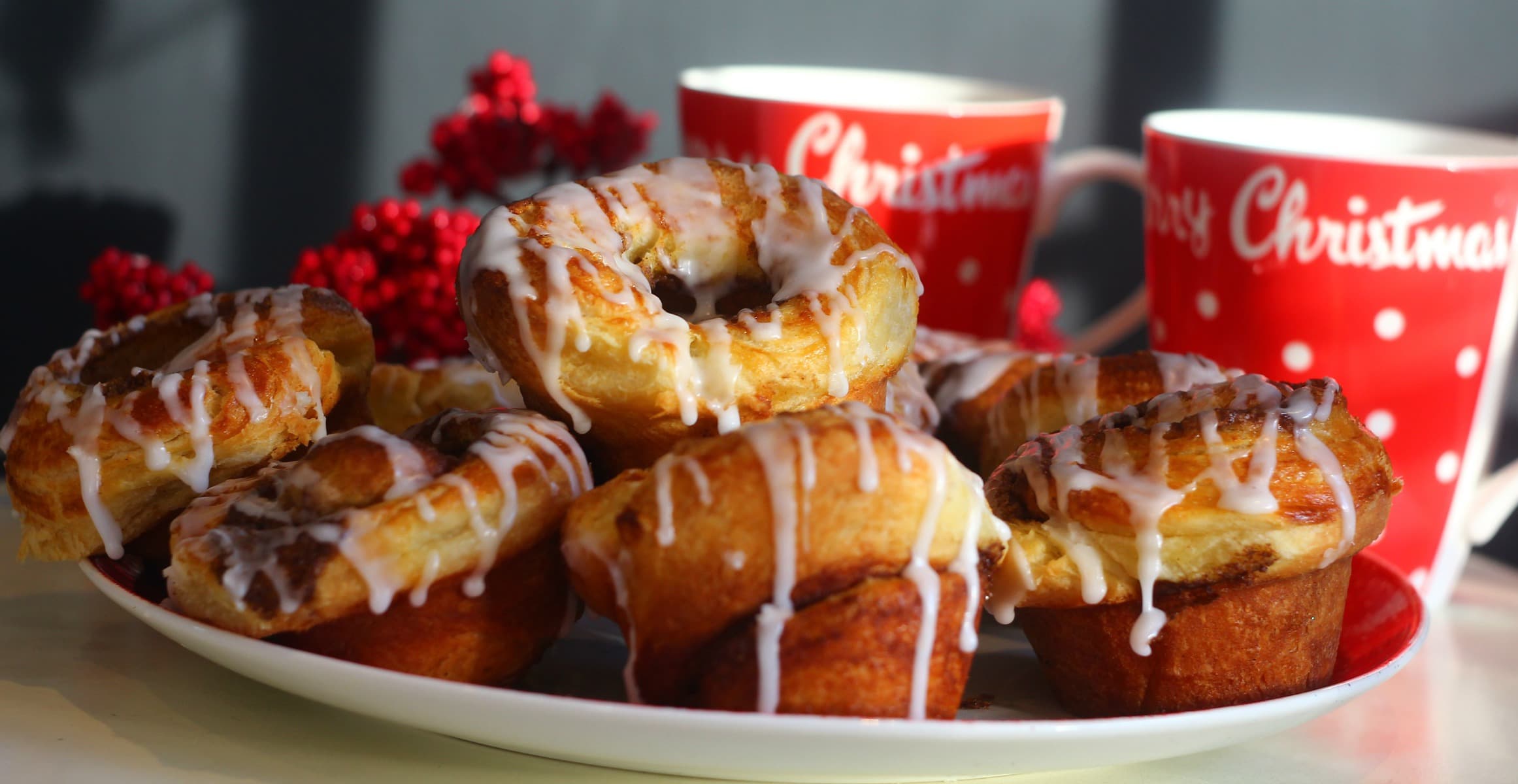 danish pastry cinnamon rolls danish pastry cinnamon rolls on a large plate drizzled with icing