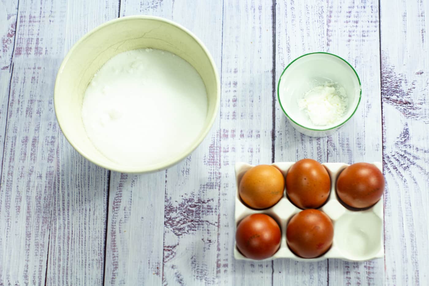 eggs, sugar and cornflour on a white board