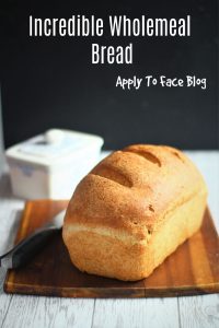 pin for wholemeal bread on a wooden board with a knife