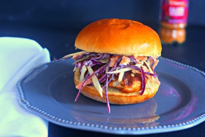 cajun chicken burger in a bun with coleslaw