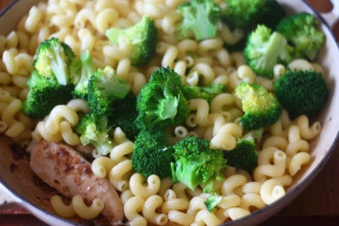 chicken, pasta and broccoli in a frying pan