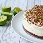 lime no bake cheesecake with bourbon biscuit base and chocolate shavings on top.