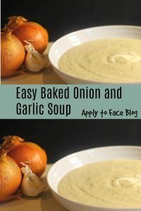 pin for baked onion and garlic soup baked onion and garlic cream soup in a bowl with onion and garlic cloves near by.