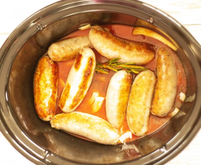sausages casserole in a slow cooker bowl