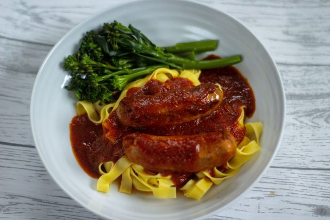 slow cooker sausage casserole Slow cooker Sausage Casserole in a white bowl with fresh pasta and broccoli