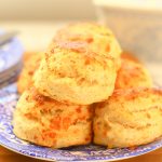 stack of cheese scones on a plate.