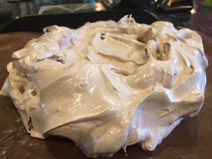 chocolate meringue on a lined baking tray