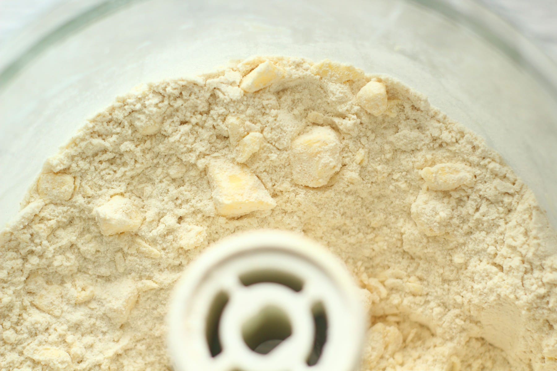 danish pastry flour and butter Danish Pastry Dough First Step In The Food Processor with small chunks of butter visible in the flour