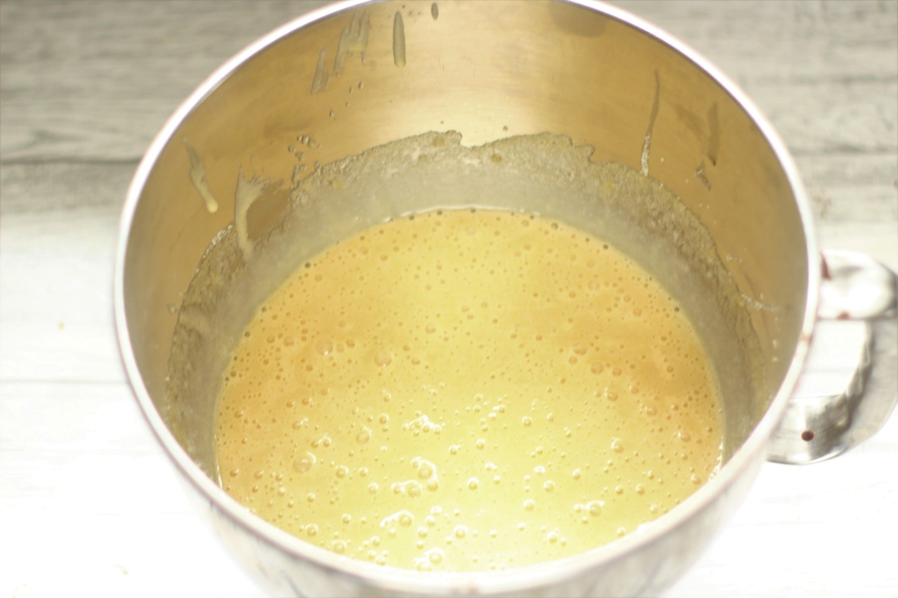 Eggs, sugar and oil whisked together in a large bowl