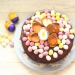 easter chocolate cake decorated with mini eggs and creme chocolate eggs