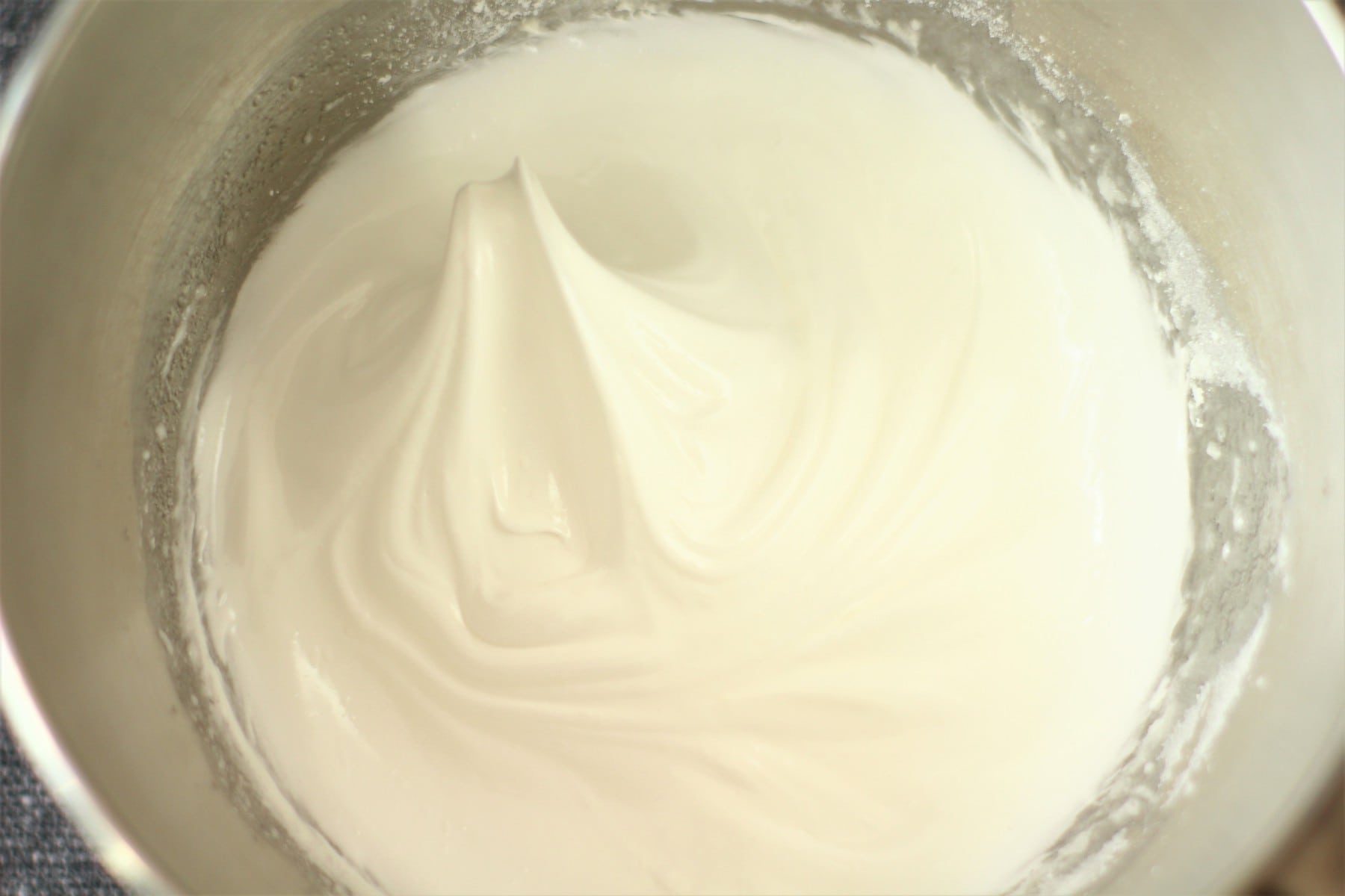 whipped egg whites in a mixing bowl.