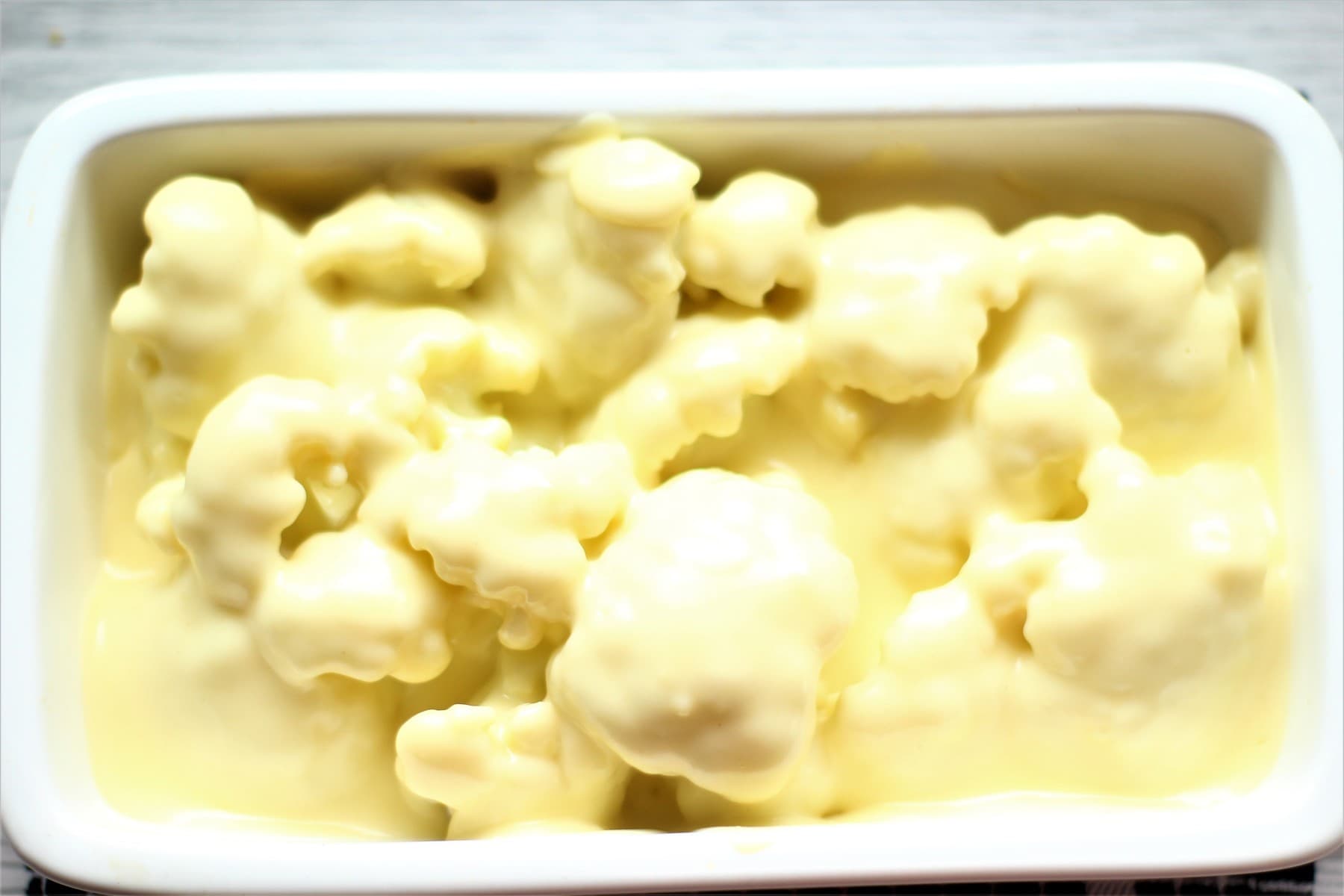 ready for the oven with the sauce poured on top
