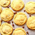 Peanut Butter Chocolate Chip Cookies on a baking tray with chocolate drops