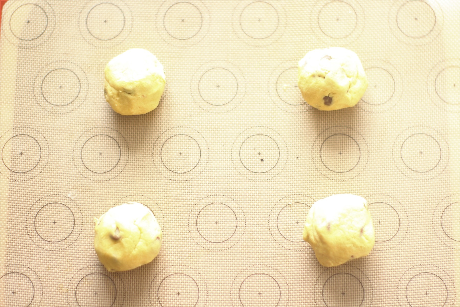 Cookie Dough Balls on a lined baking tray