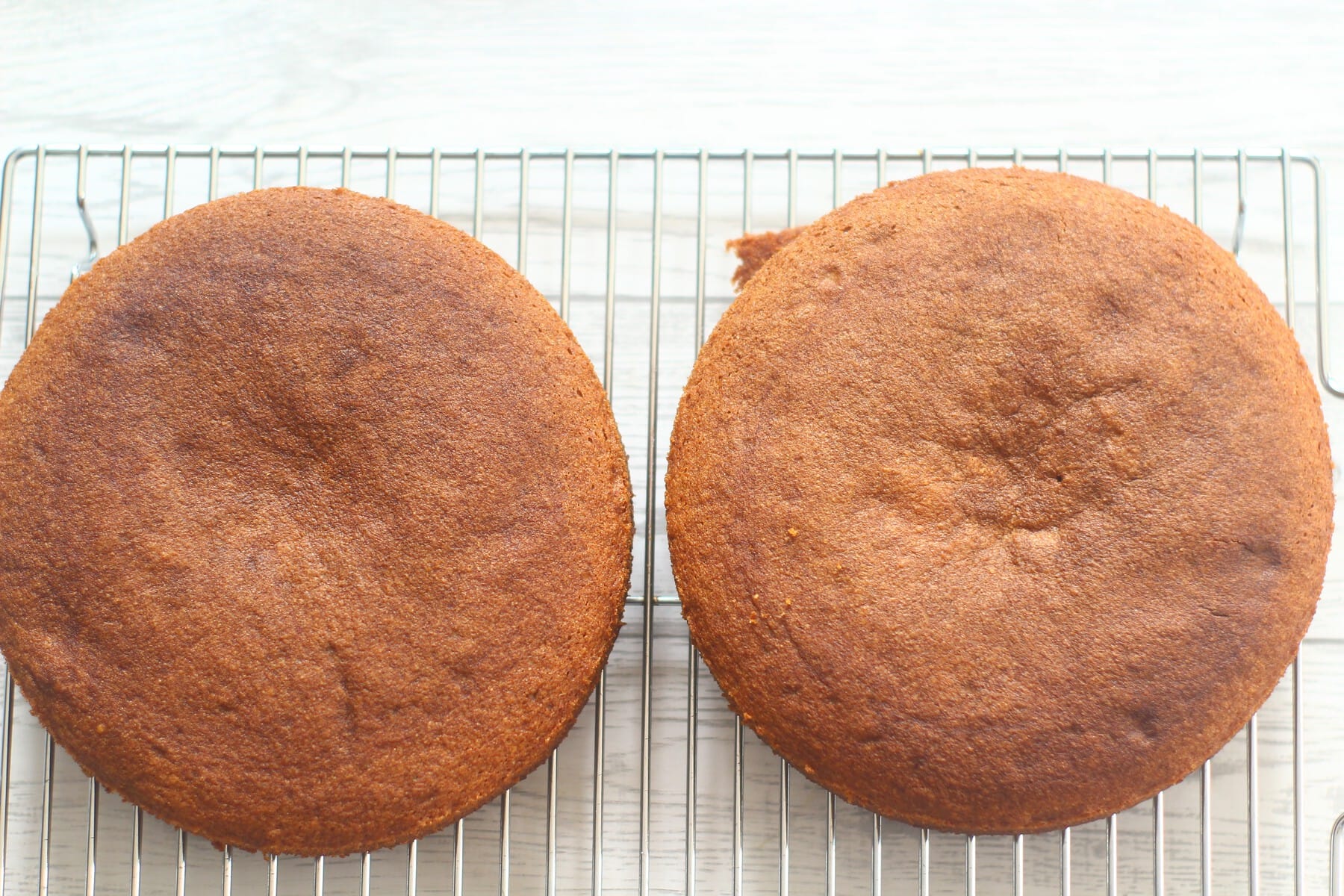 baked coffee and walnut cakes on a wire rack