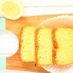 lemon drizzle cake sliced on a board