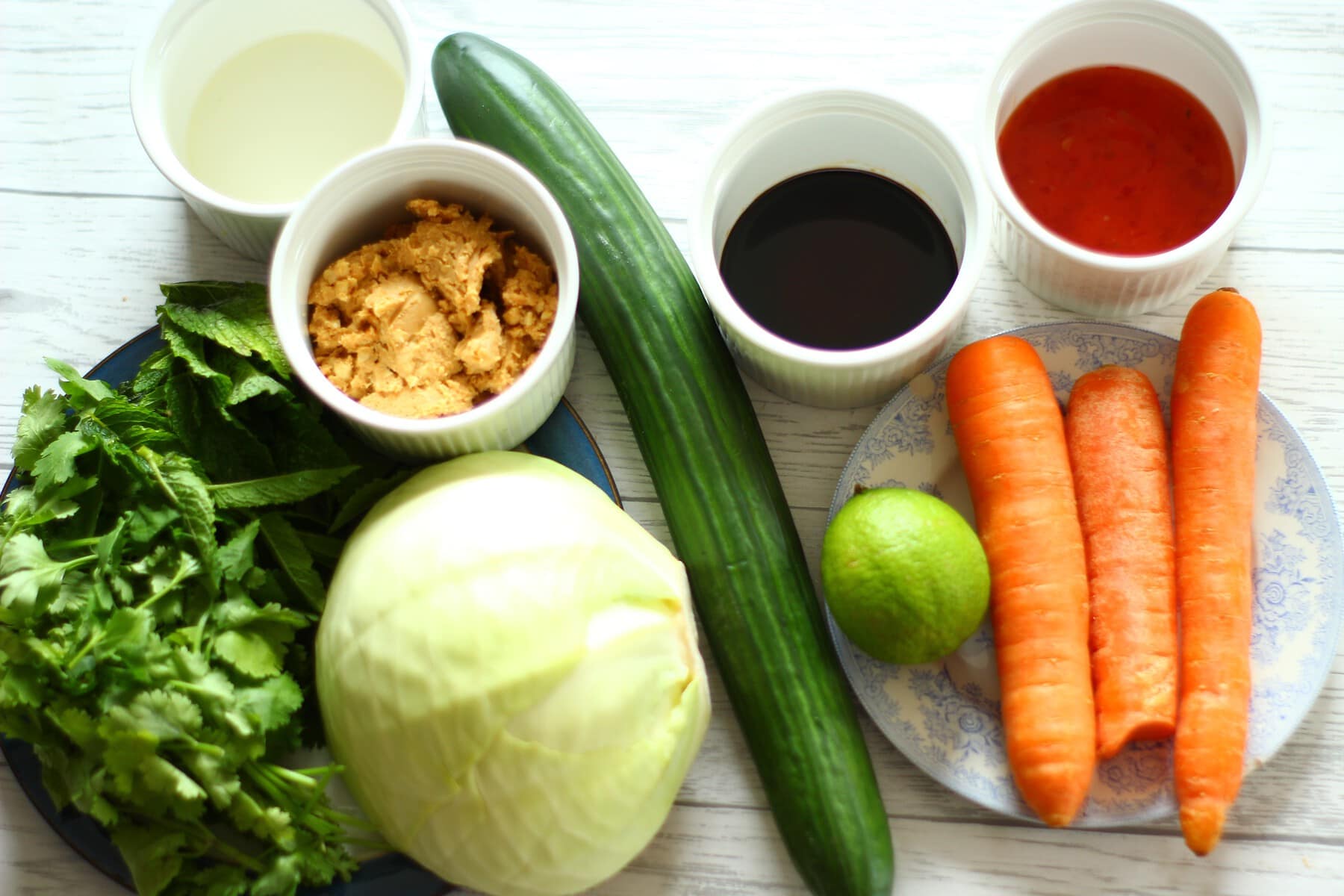 peanut butter,soy sauce,sweet chilli sauce,white cabbage,lime,coriander,mint,carrots,ground nut oil,cucumber