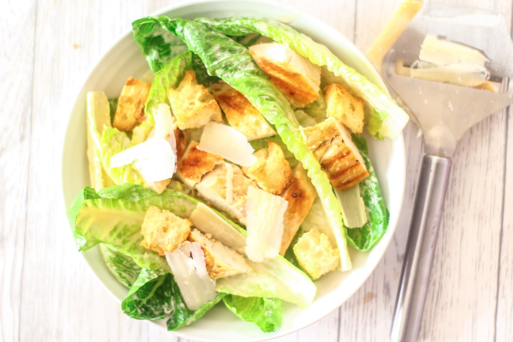 chicken caesar salad in a bowl