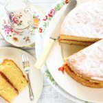 vicoria sponge cake with a slice of cake on a plate with a cake fork