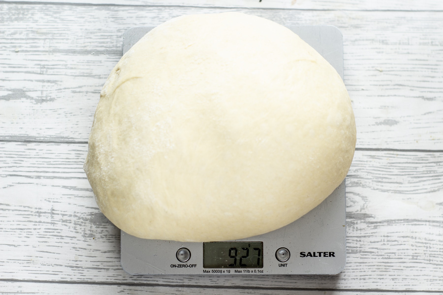 best bread rolls dough being weighed on digital scales