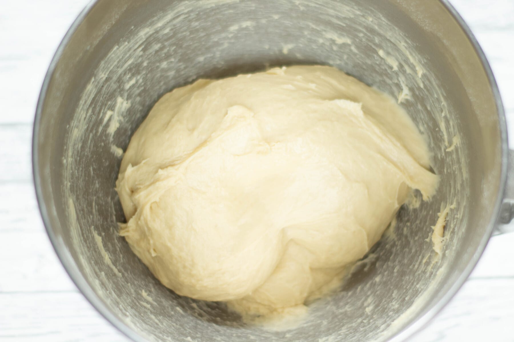sticky bread dough in a mixing bowl