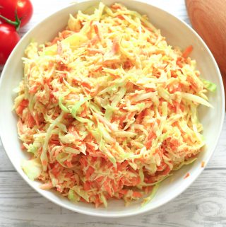 piled high coleslaw in a serving bowl