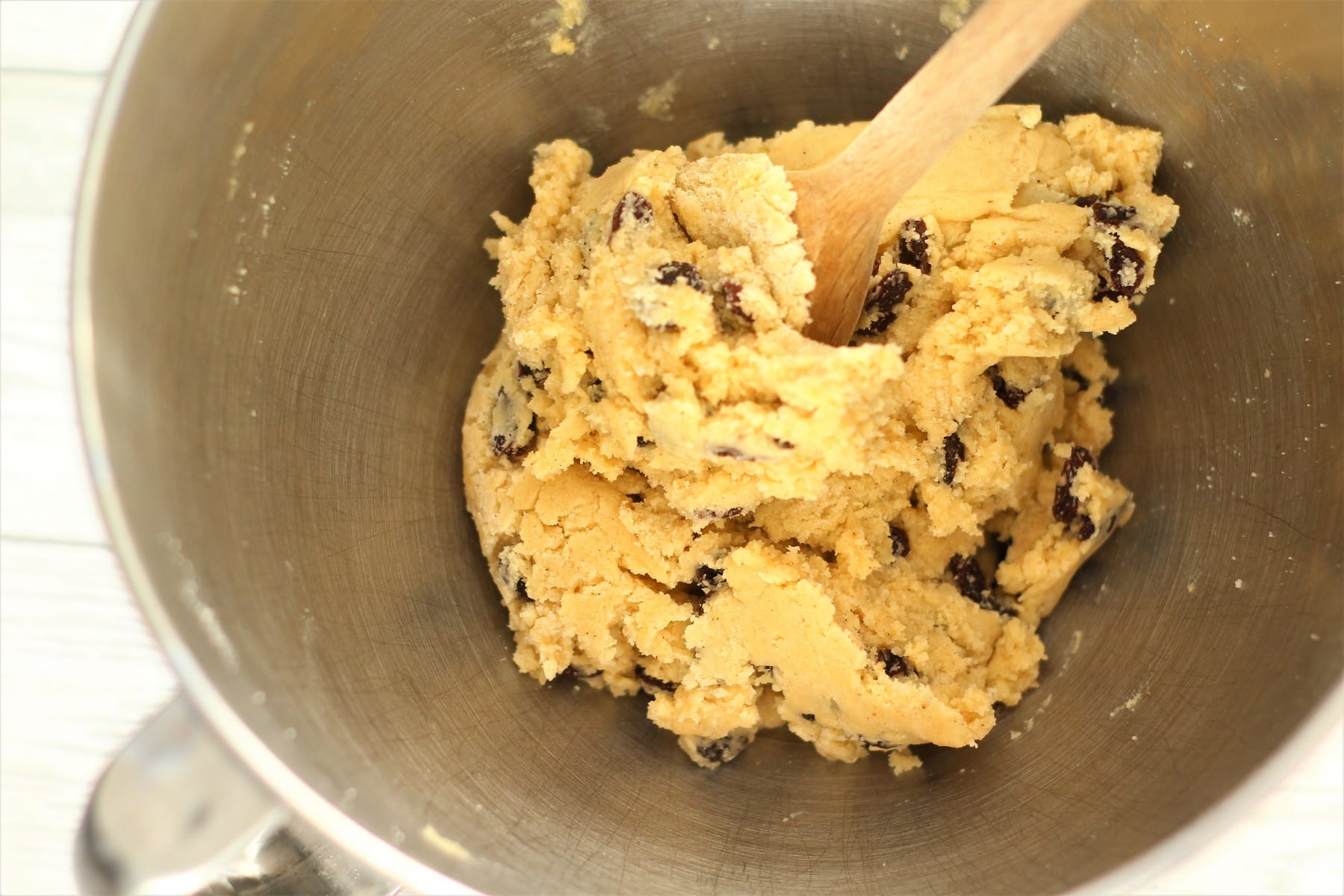 rock cake dough in a mixing bowl with a wooden spoon