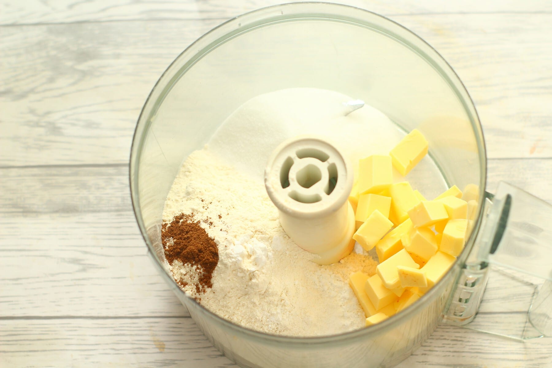 butter, sugar, flour, baking powder, salt, mixed spice in a food processor bowl