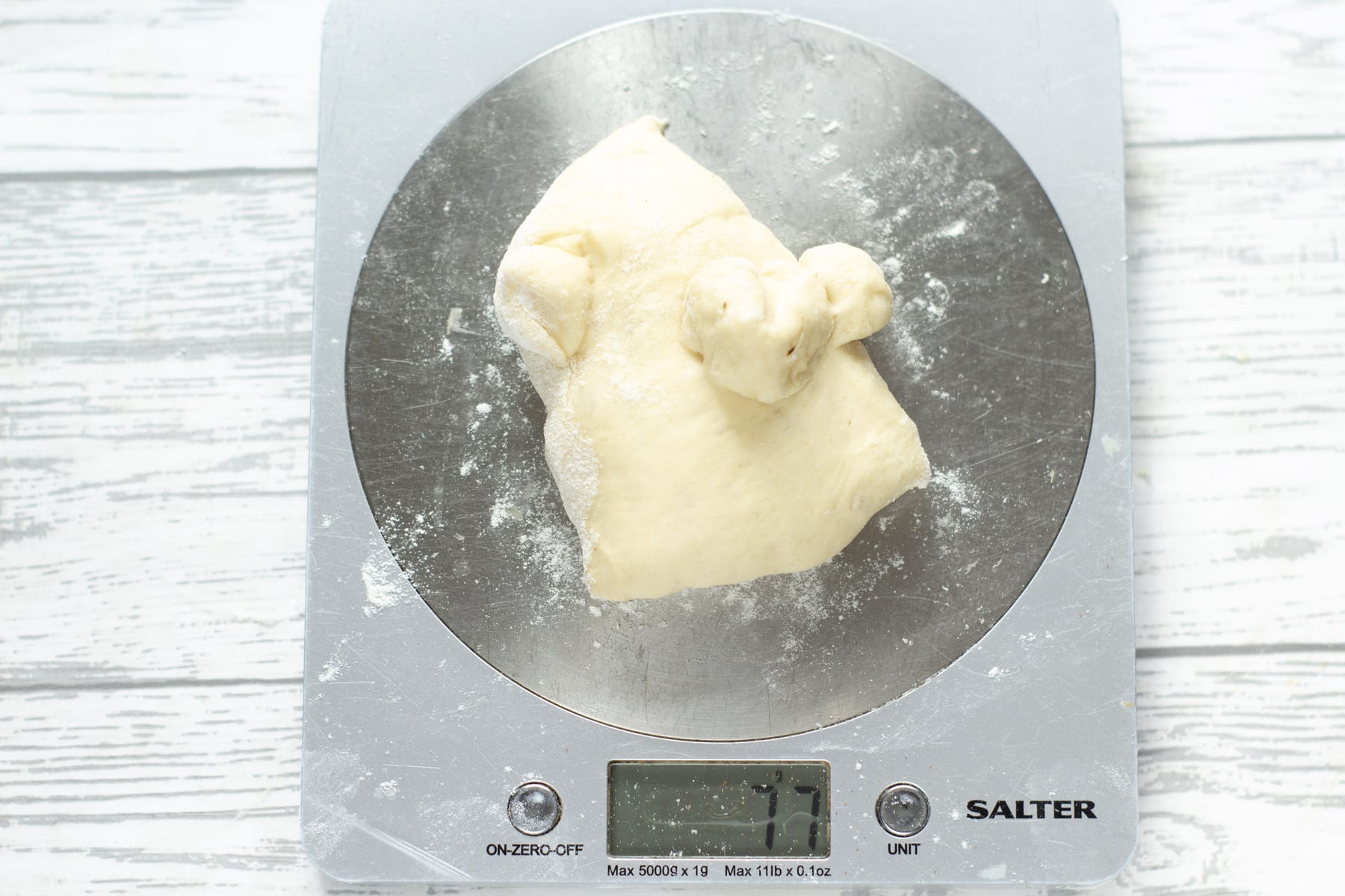 weighing dough on digital scales