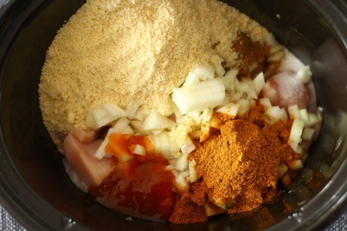 slow cooker chicken ingredients in the slow cooker bowl