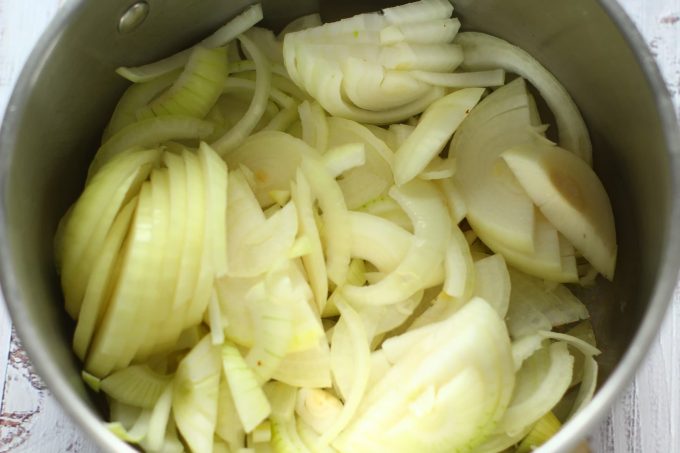 sliced onions in a saucepan
