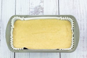 banana bread batter in a lined loaf tin