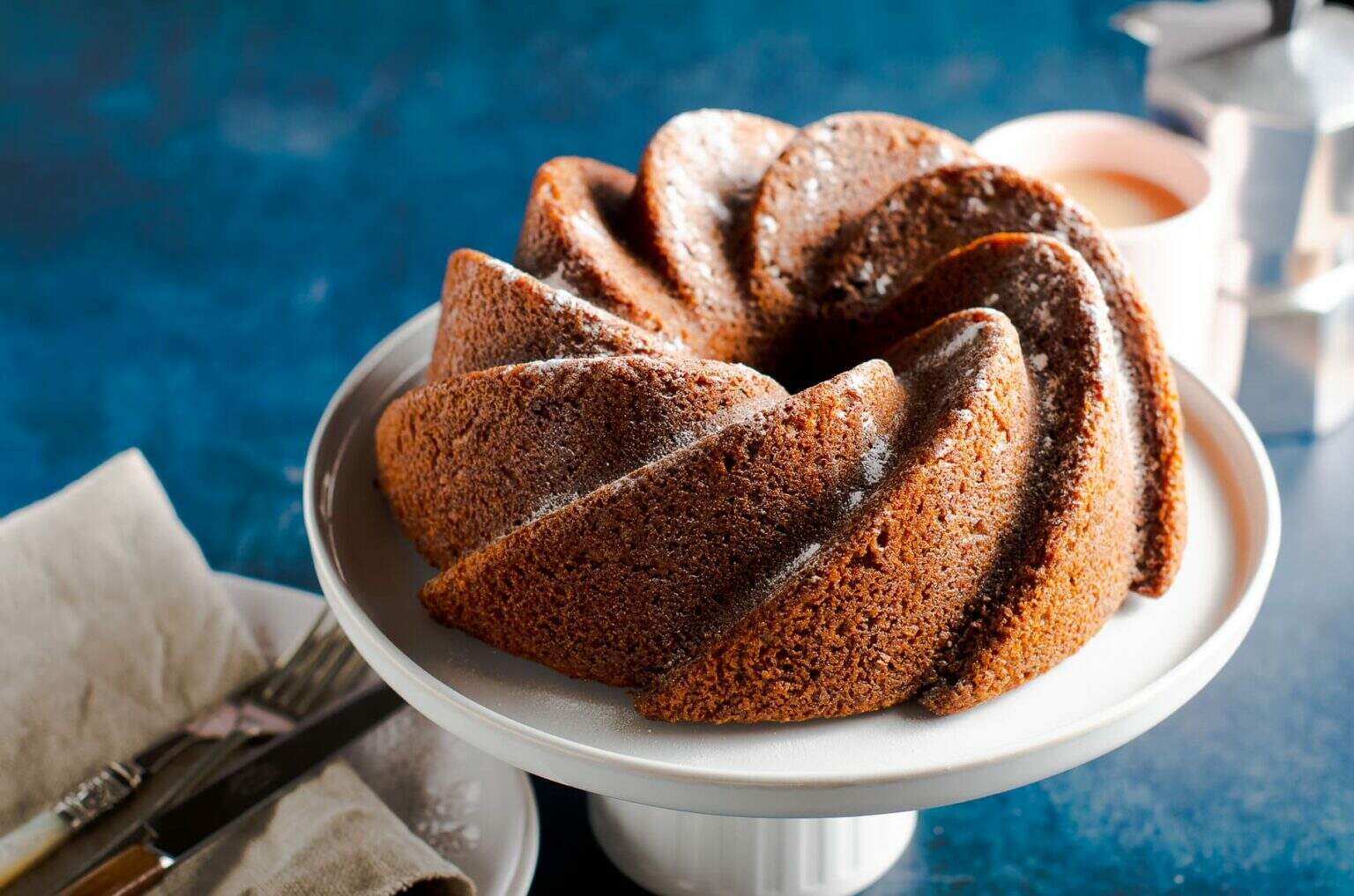 pumpkin cake on a white cake stand