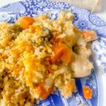 chicken and broccoli gratin on a blue and white plate