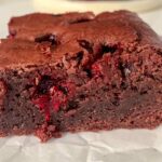 raspberry chocolate brownies square on baking paper